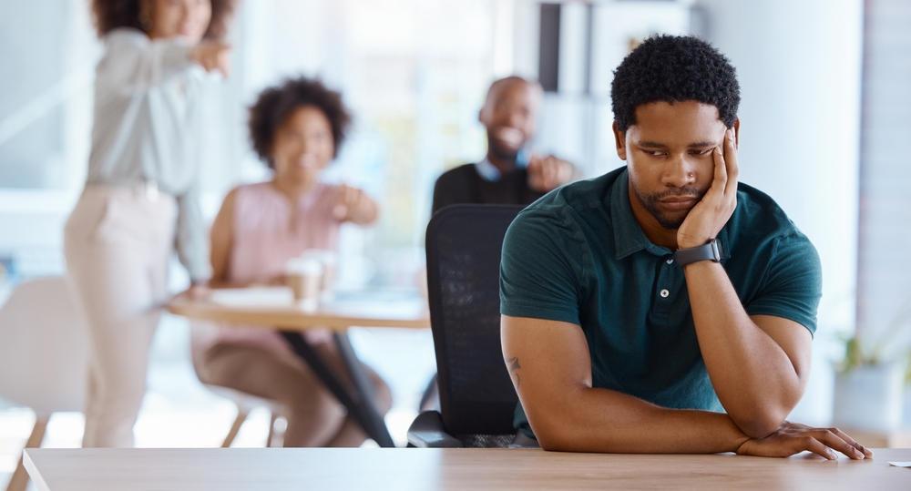 A man suffering from workplace harassment