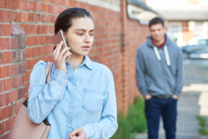 A woman calling for help due to stalking