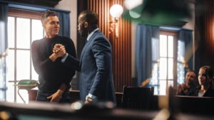 A client and his lawyer celebrate their victory in court